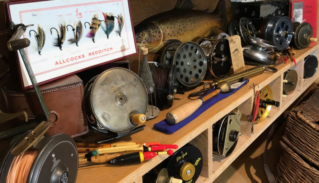 Sold at Auction: Collection of vintage fishing equipment