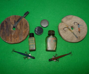 A mixed bundle of vintage tackle comprising Pflueger,Kalium,early Gut Eyed salmon flies
