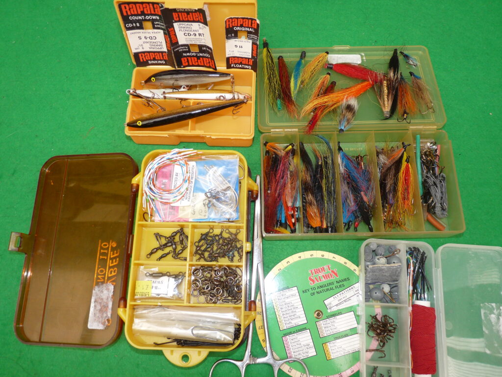 Rapala sinking & floating plugs, Wadington & tube flies in boxes, Salmon fishing accessory kit