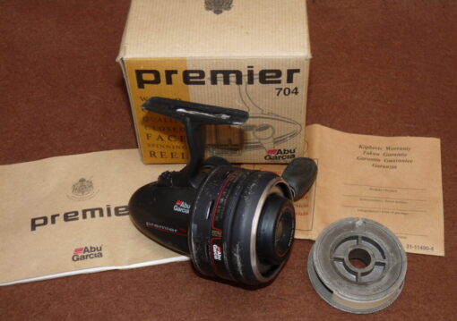 Abu Premier 704 closed face reel for repair+ spare spool, papers in makers box