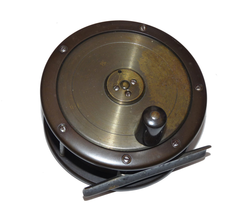 Antique London pattern 4.5” ebonite and brass salmon fly reel c 1890.