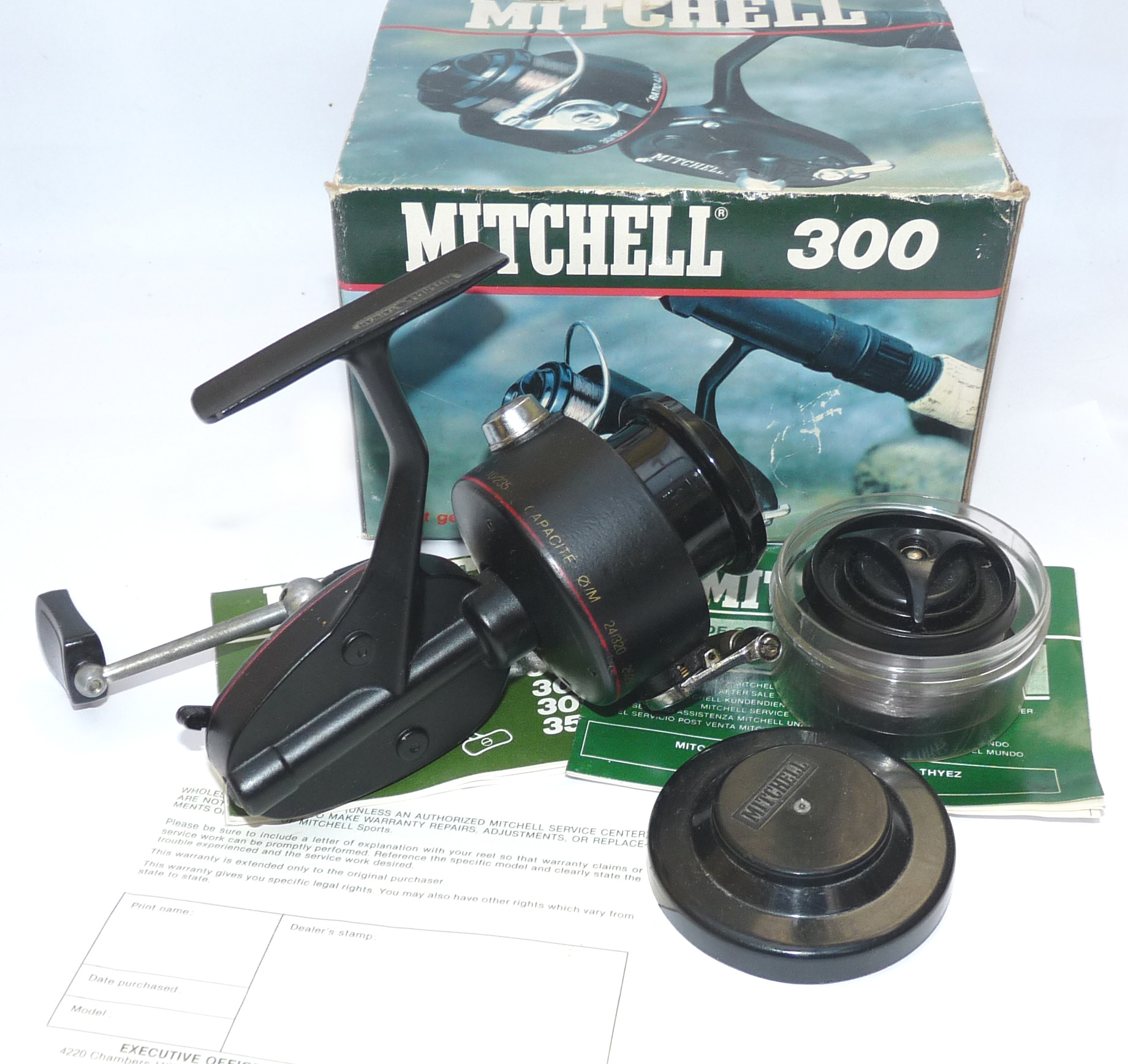Mitchell 300 vintage spinning reel with box spool and papers to