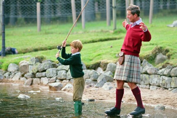 King Charles III with Prince Harry on the River Dee at Balmoral