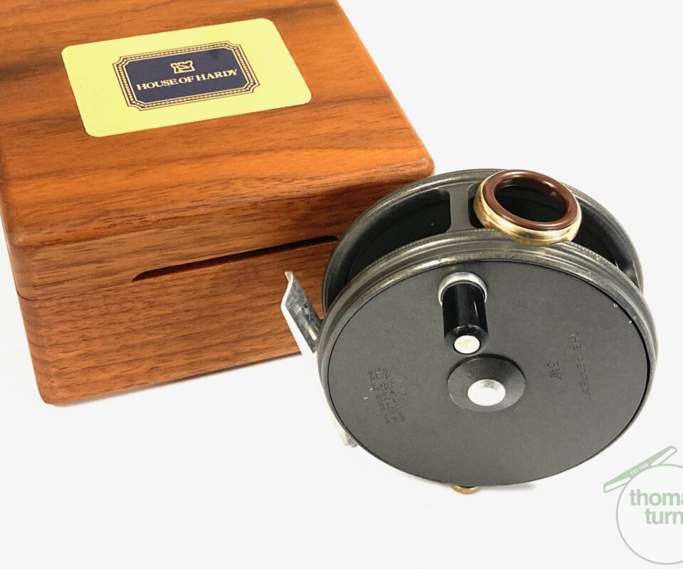 Hardy Perfect 3 3/8″ alloy fly reel with red guide and Hardy Walnut fitted case