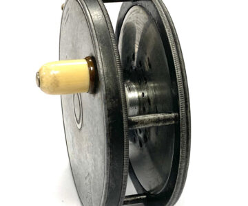 Alternative view of Hardy Perfect 3 7/8" Early Model Trout Fly Reel With Rod In Hand