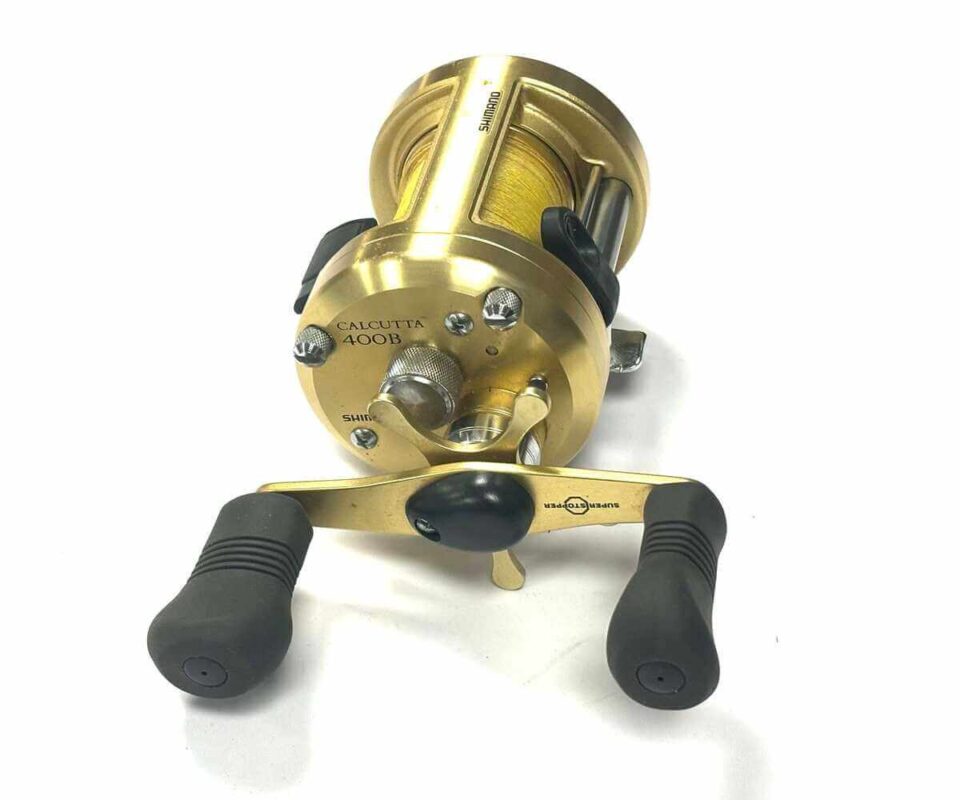   Shimano Calcutta 400 multiplier sea reel with gold finish plus optional check